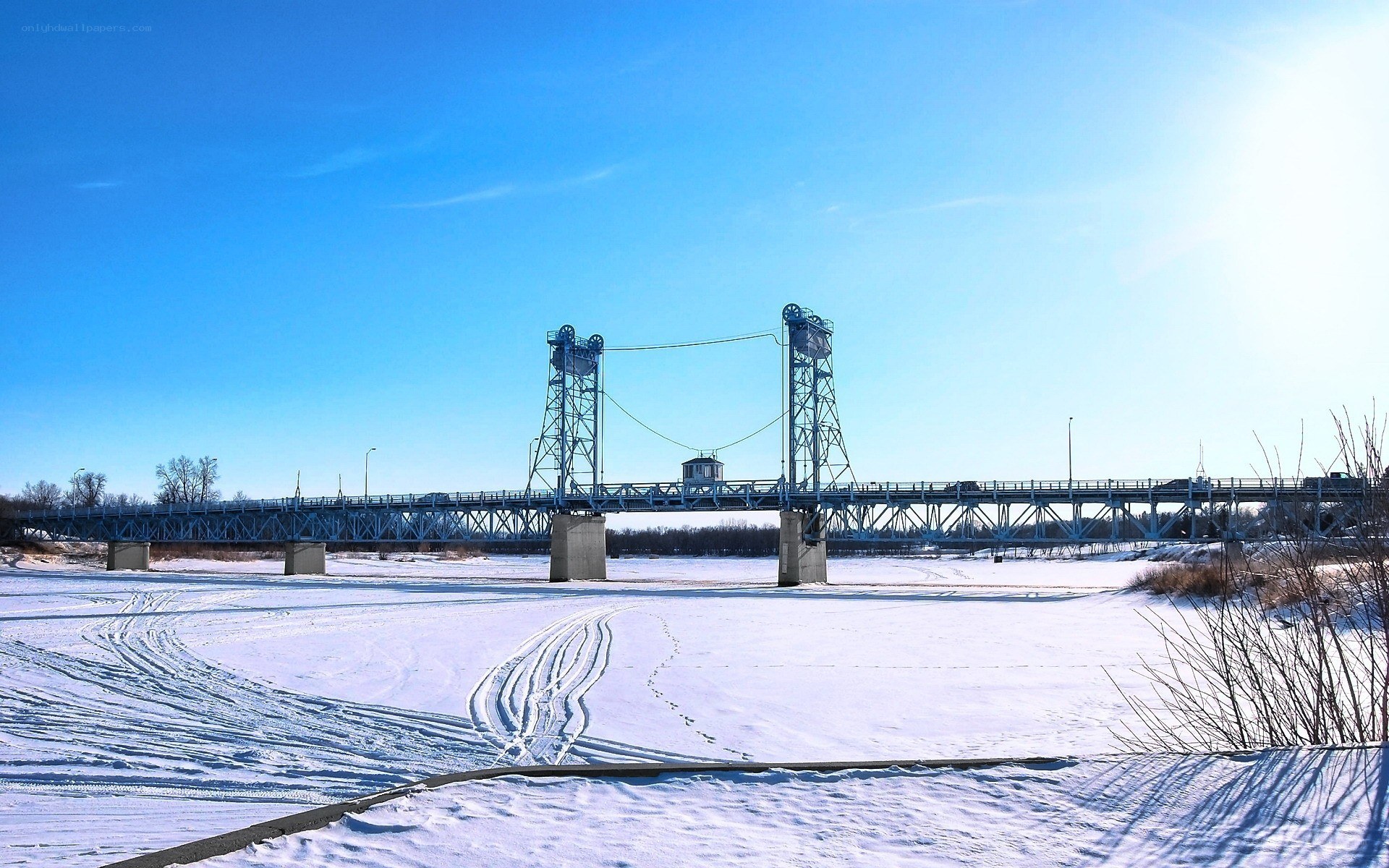 Blue bridge over frozen river