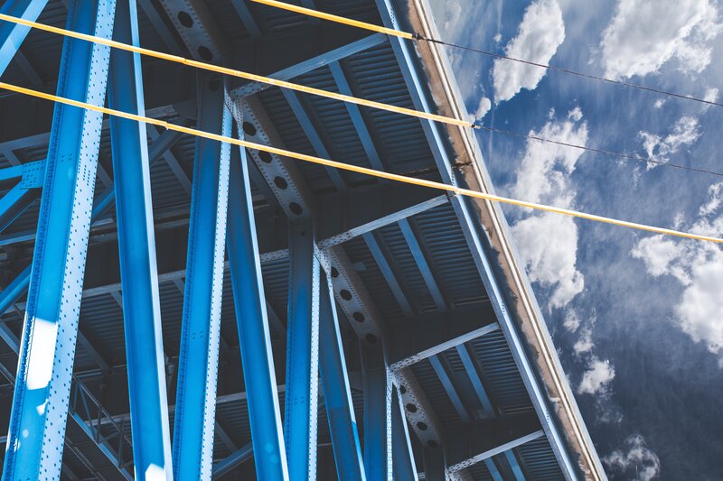 blue bridge structure under sky