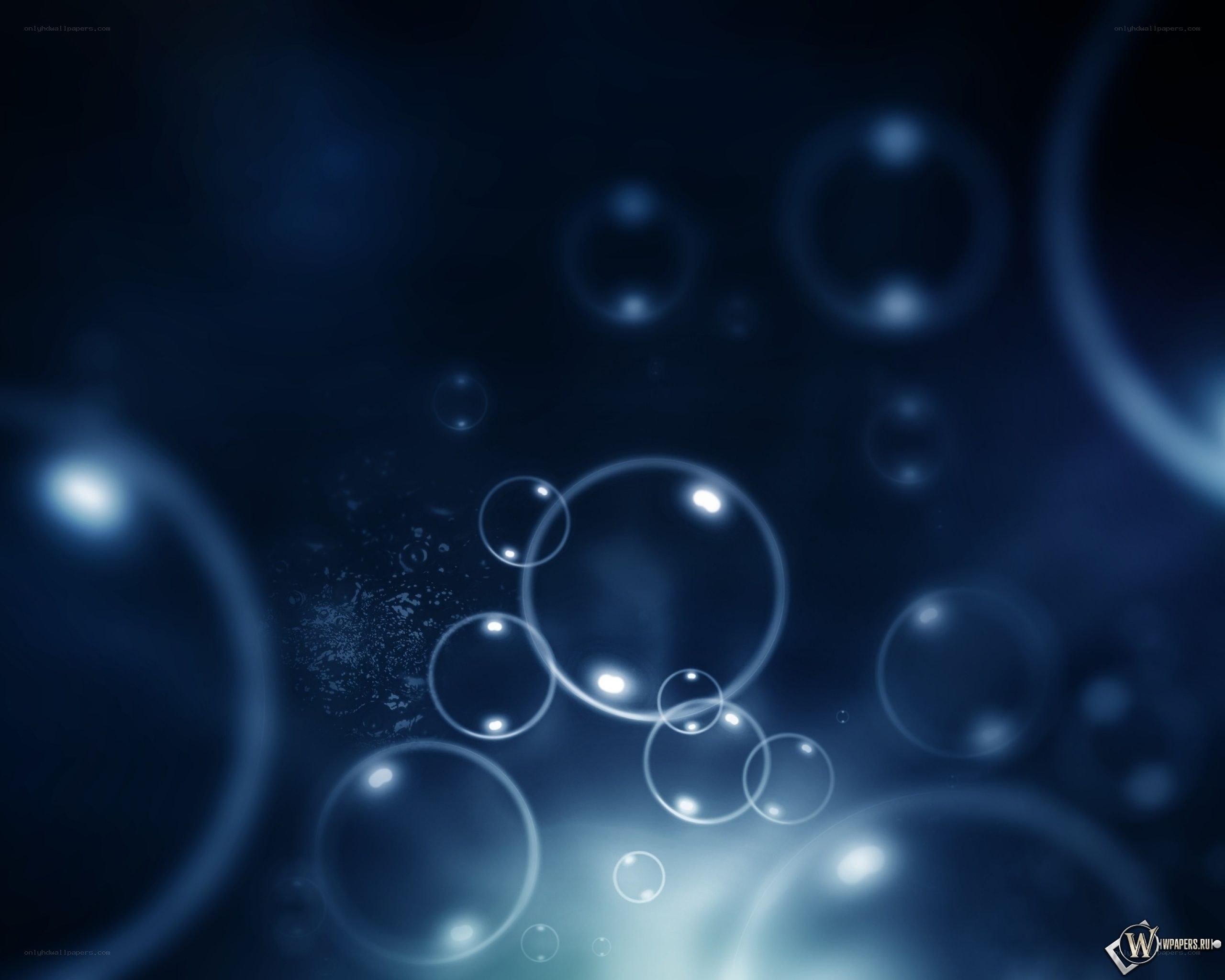 blue bubbles floating in dark