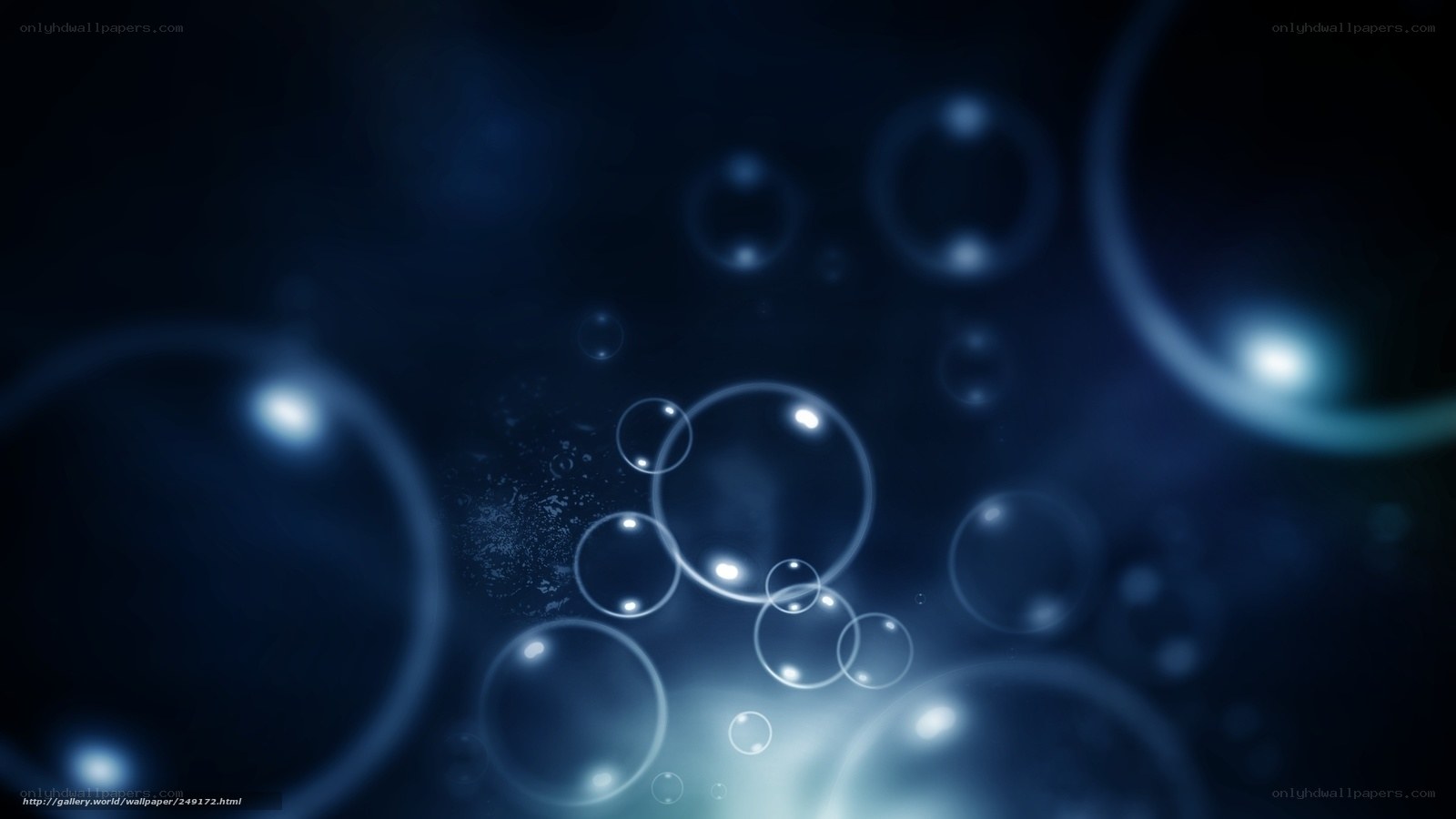 Blue bubbles floating in dark