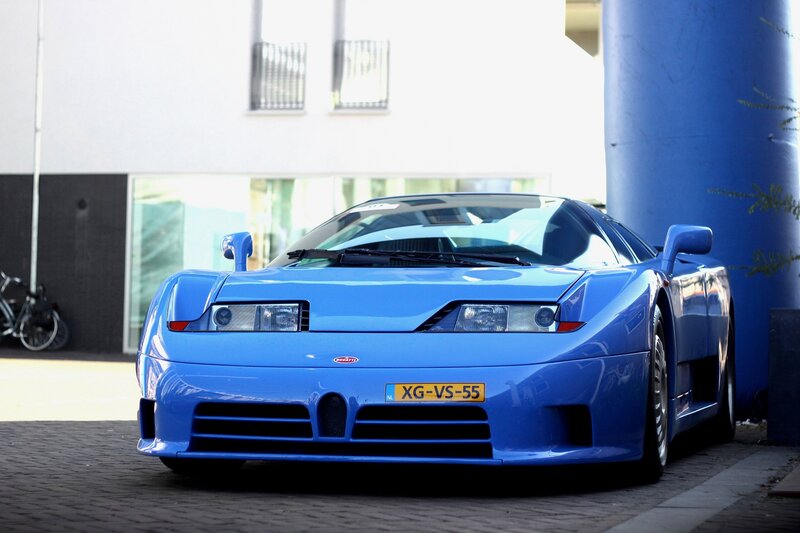 Blue Bugatti EB110 parked