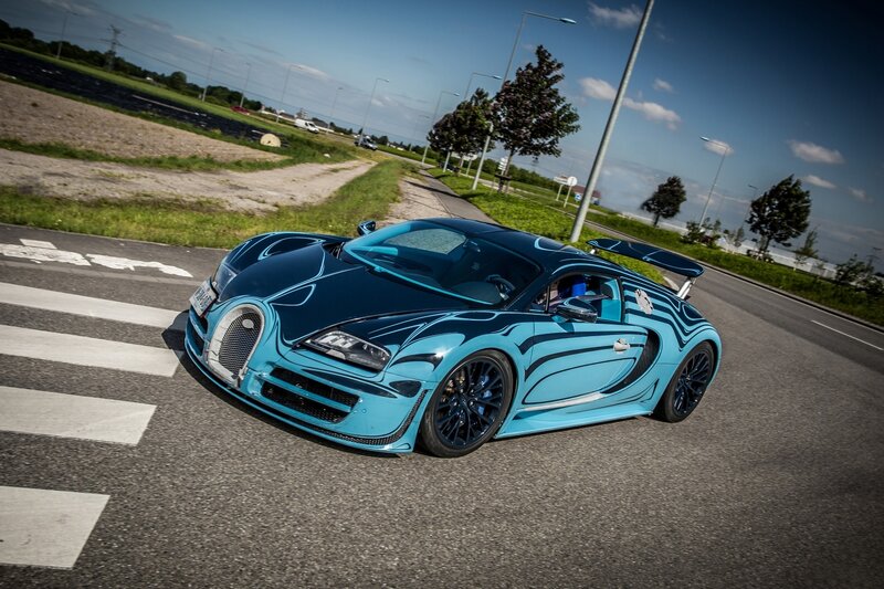 Blue Bugatti on a road