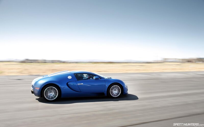blue bugatti on a track