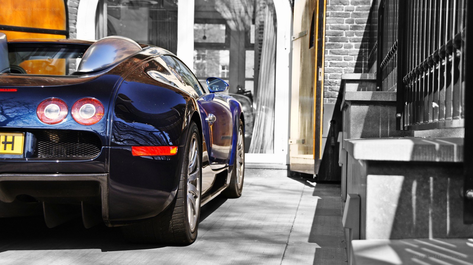 Blue Bugatti parked on street