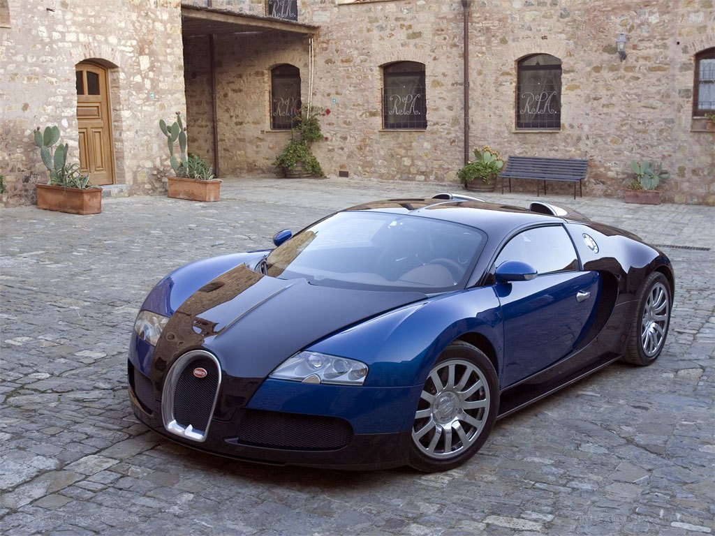 Blue Bugatti Veyron in courtyard