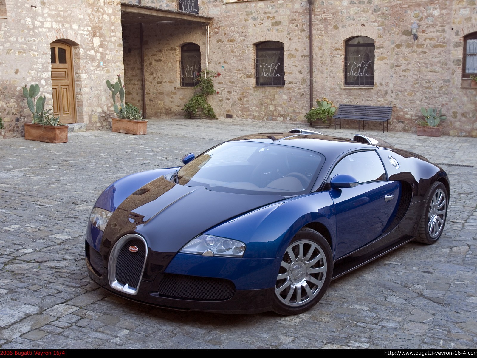Blue Bugatti Veyron in courtyard
