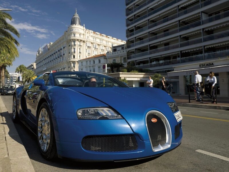 Blue Bugatti Veyron on a city street