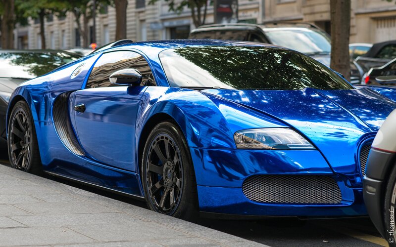 Blue Bugatti Veyron on city street