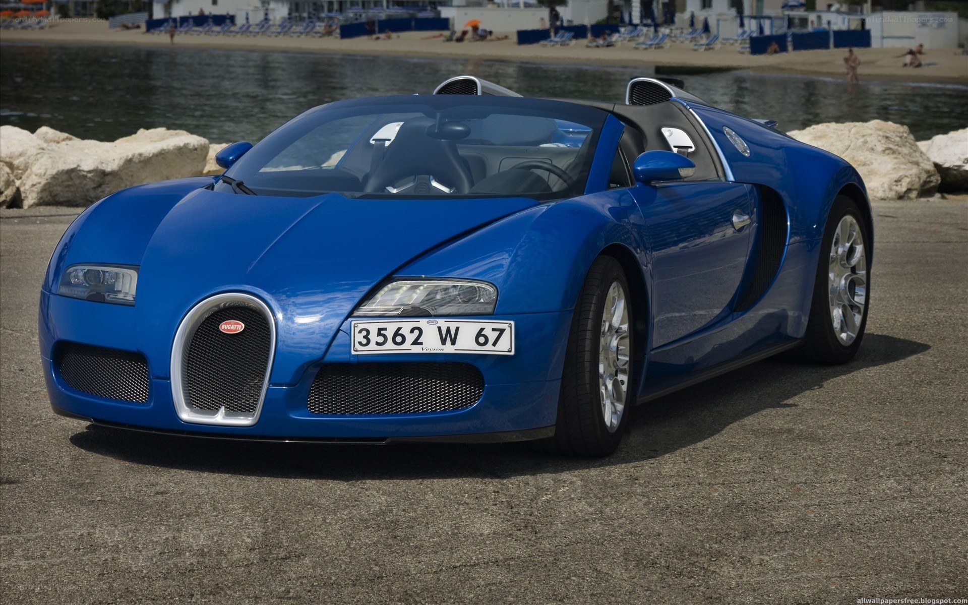 Blue Bugatti Veyron on the beach