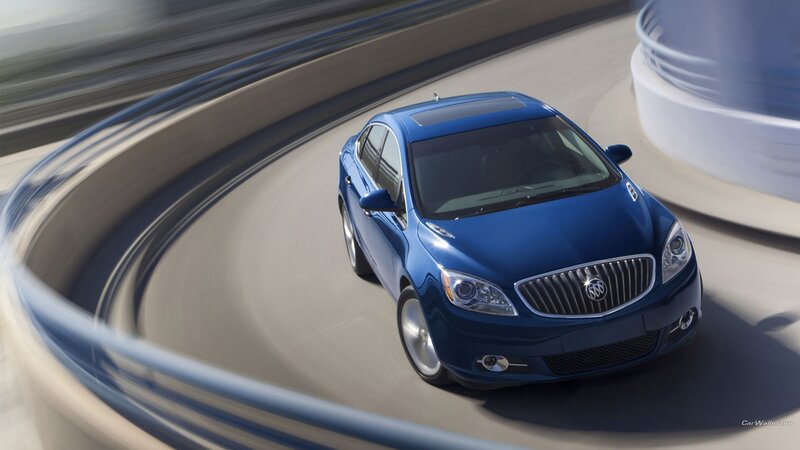 Blue Buick sedan on a curved road