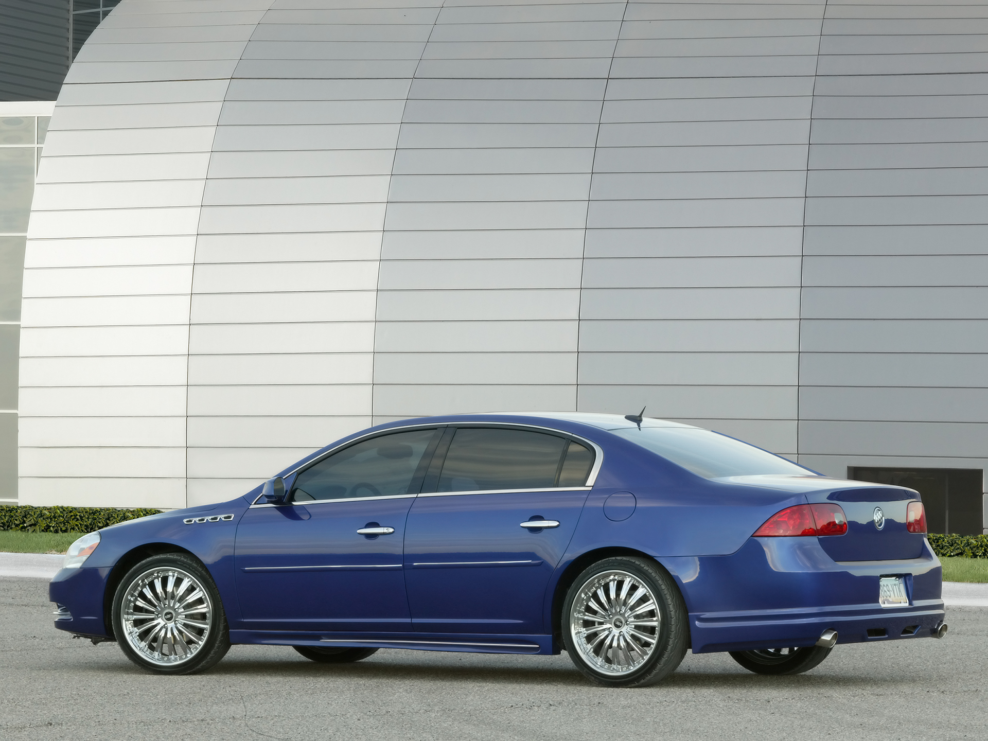 blue buick sedan parked
