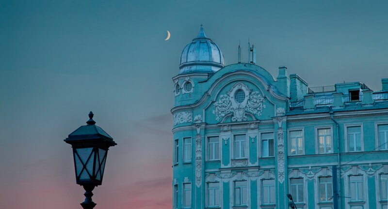 Blue Building with Crescent Moon — Serene