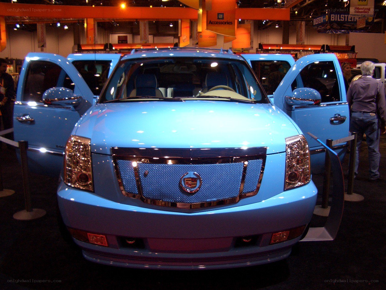 blue cadillac suv on display
