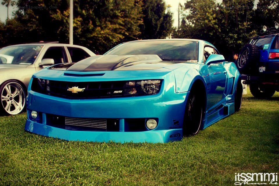 blue camaro at car show