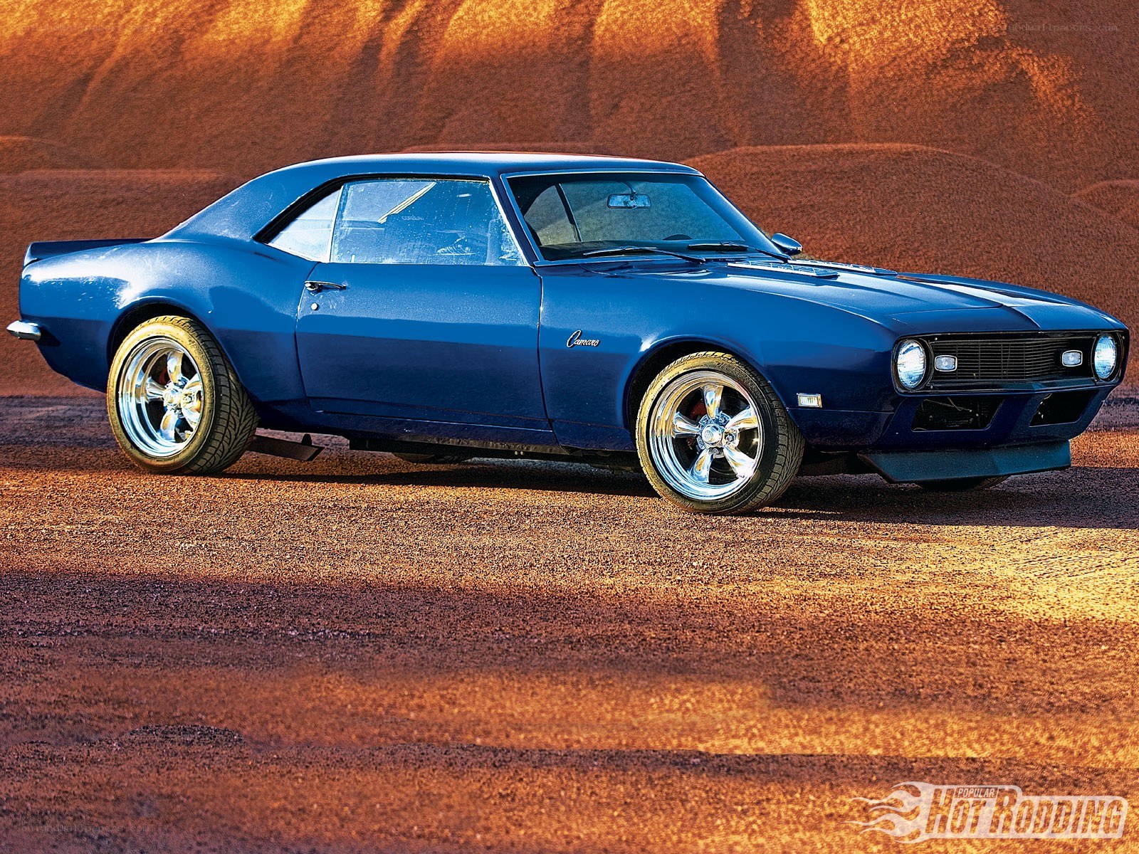 blue camaro in desert