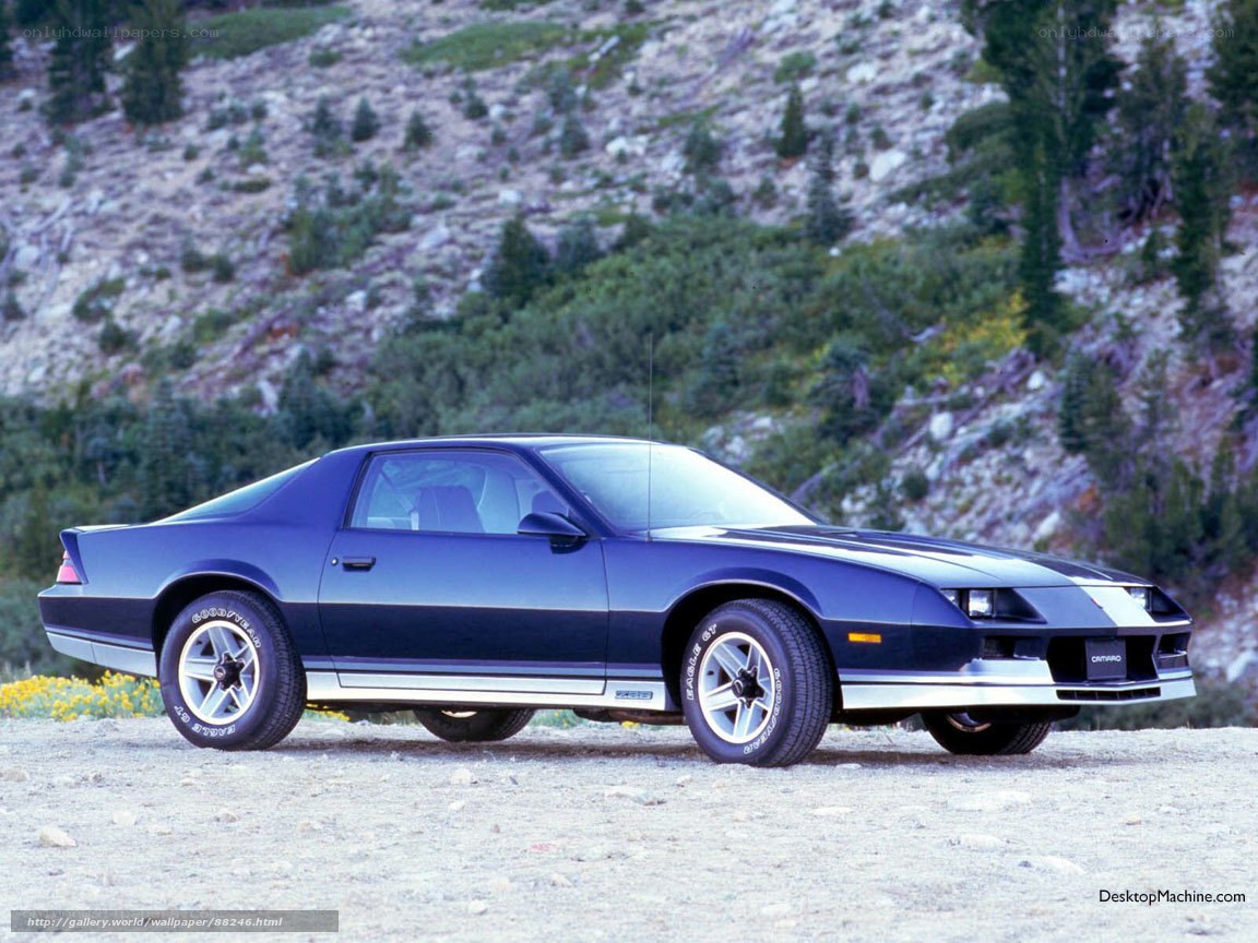 Blue Camaro on a mountain road