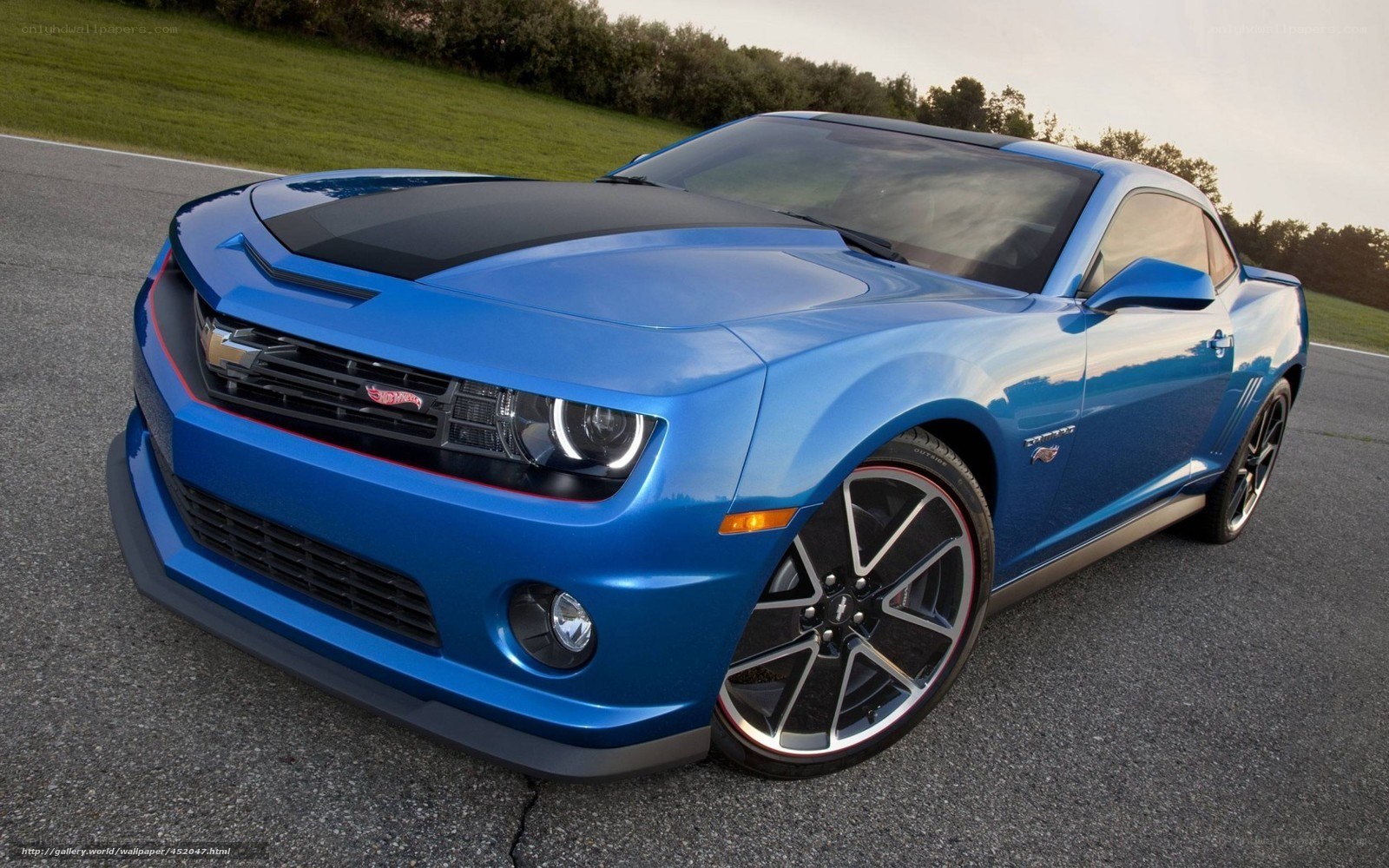 Blue Camaro on a racetrack