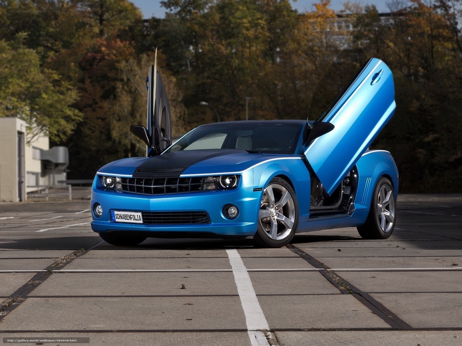 Blue Camaro with gull-wing doors