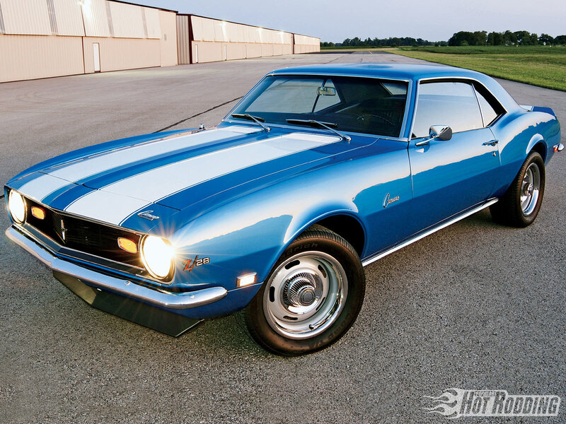 Blue Camaro with racing stripes