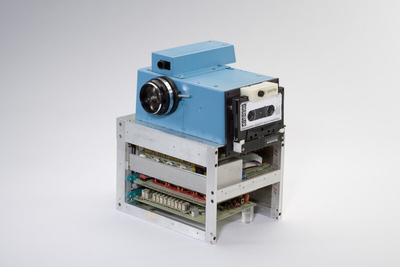 blue camera on metal frame