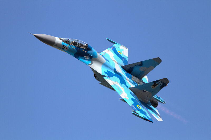 Blue Camouflaged Jet Fighter — Dynamic, Afternoon