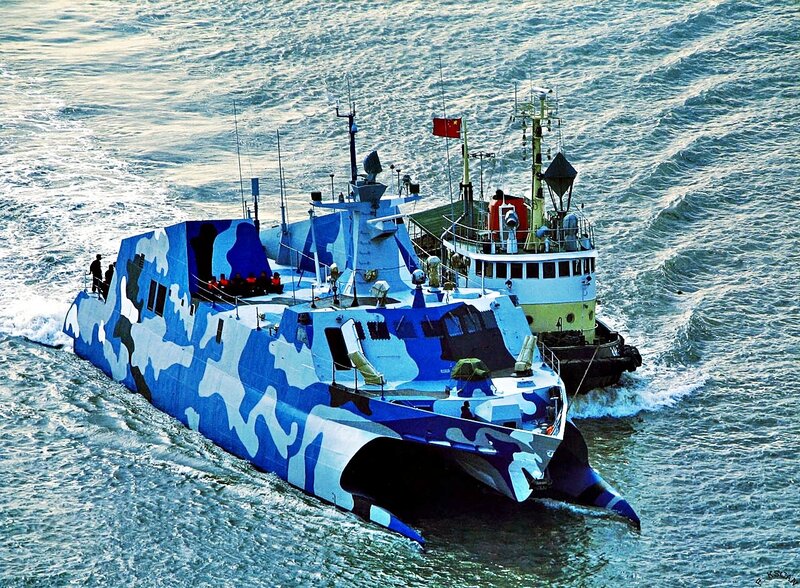 Blue camouflaged military boat