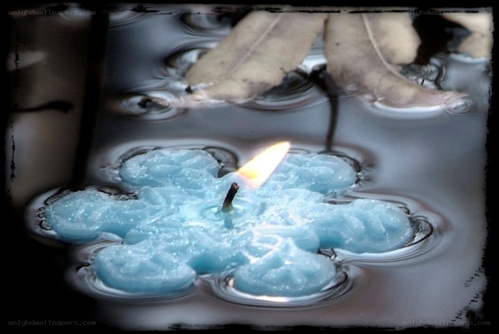 blue candle on water