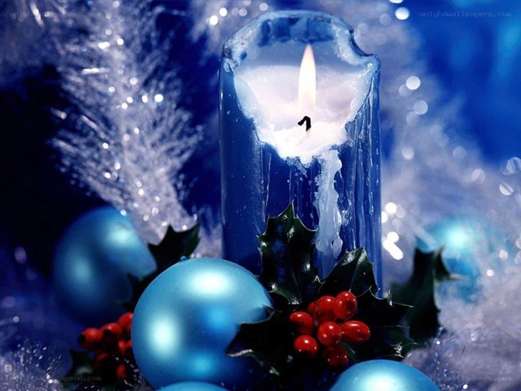 blue candle with holiday decor