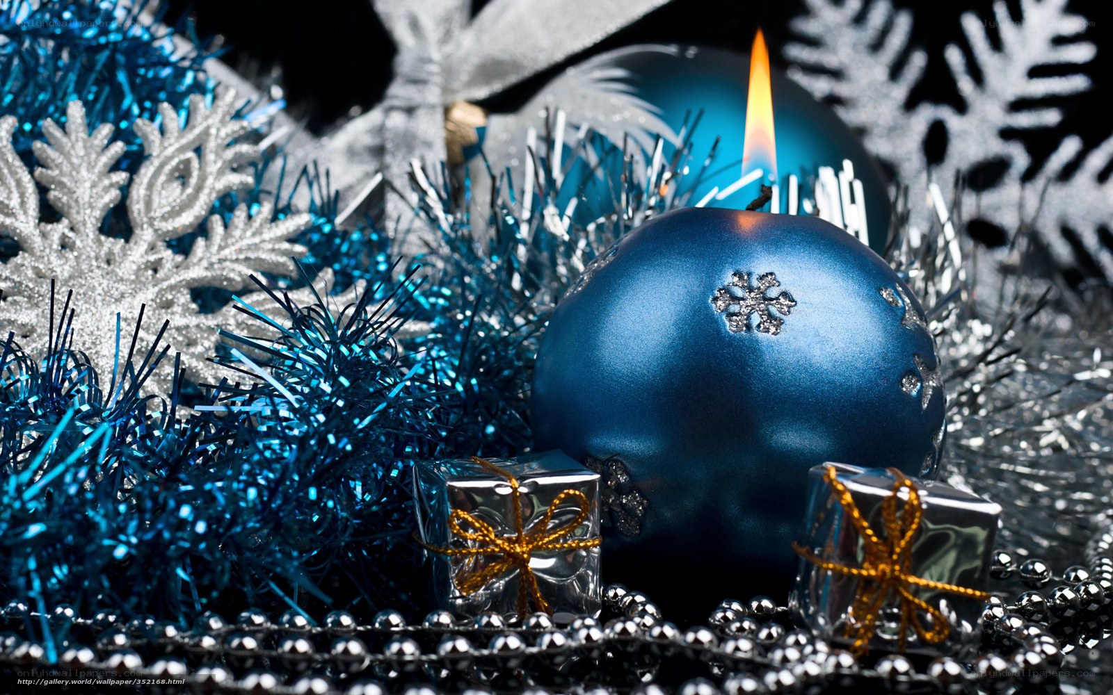 Blue candle with holiday decor