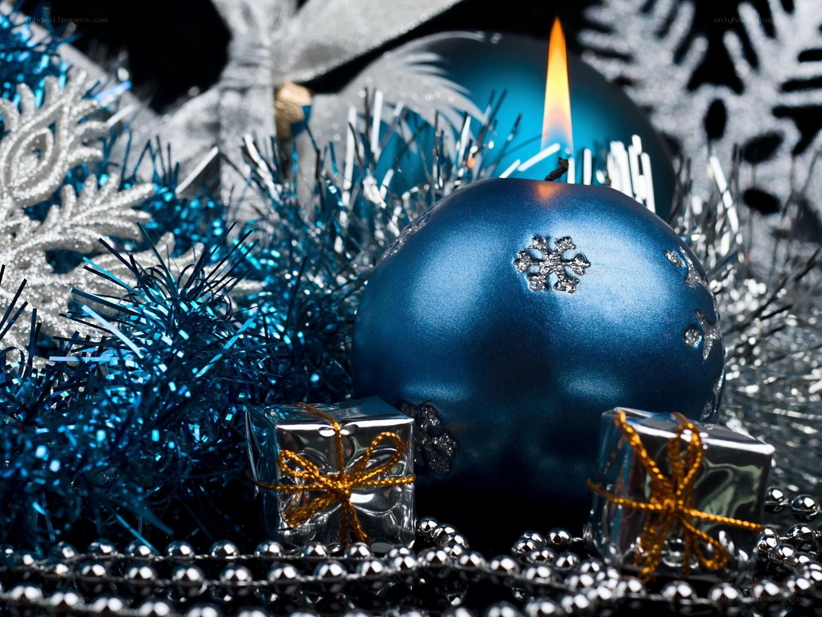 blue candle with ornaments