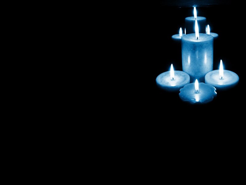 blue candles in darkness