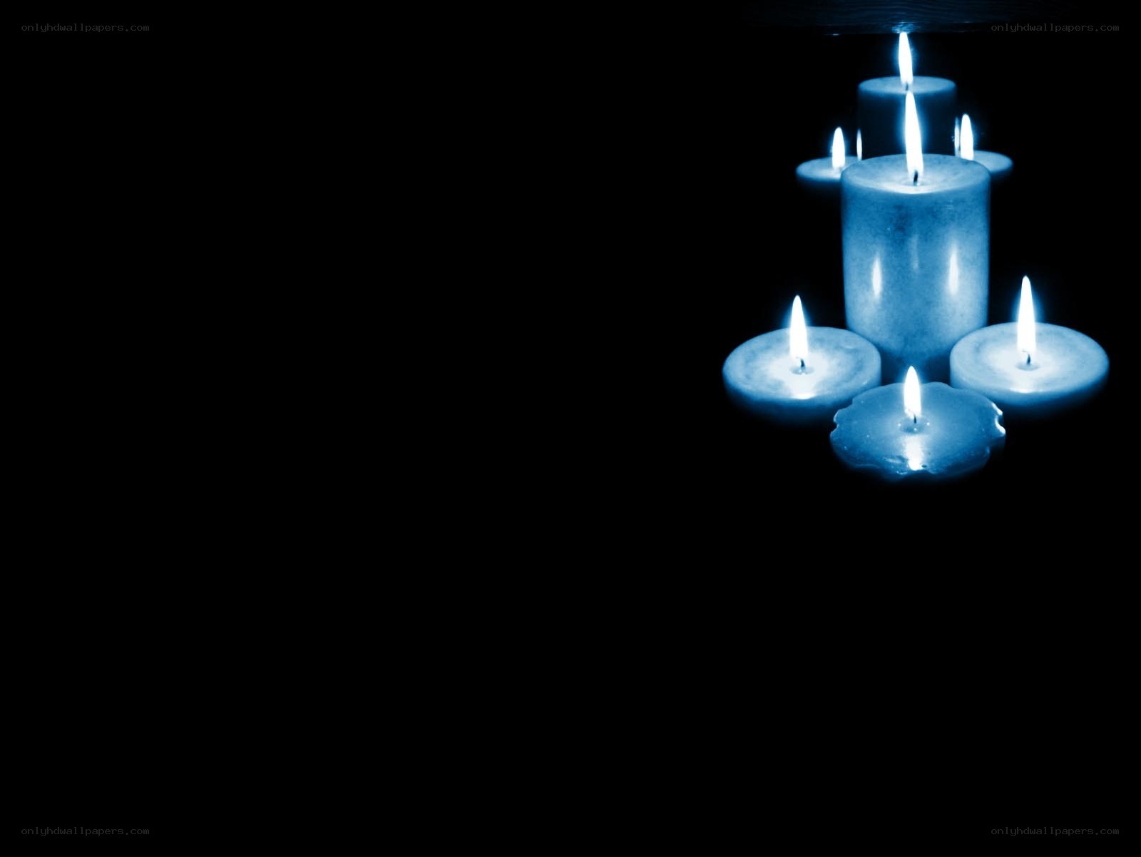 blue candles in darkness