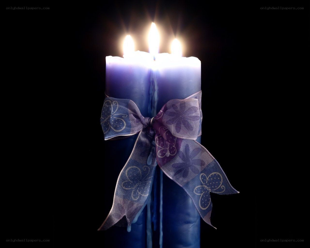 blue candles with ribbon