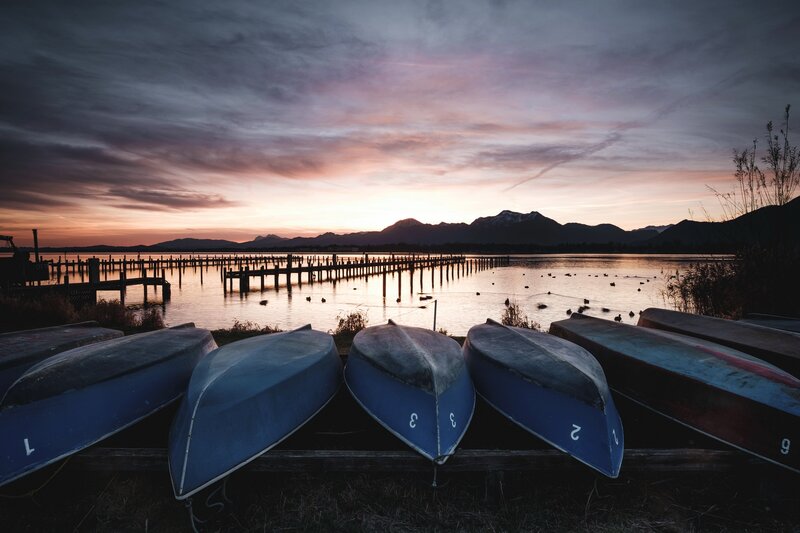 Blue Canoes on Shore — Serene