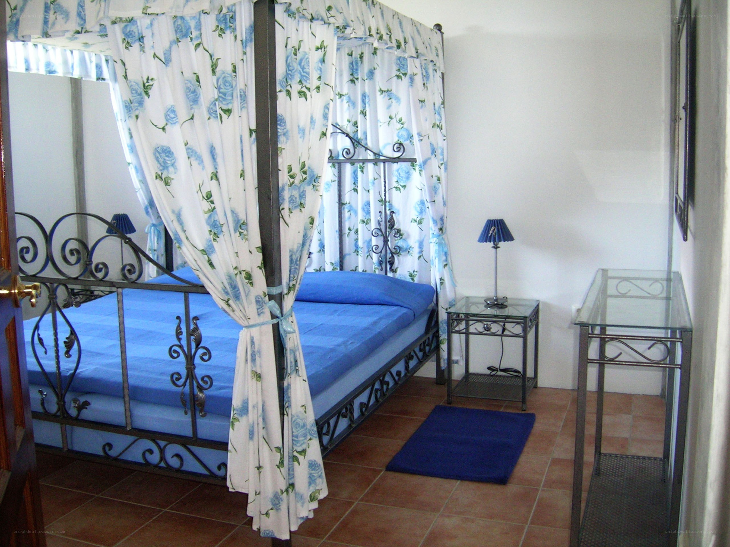 Blue-canopied bedroom