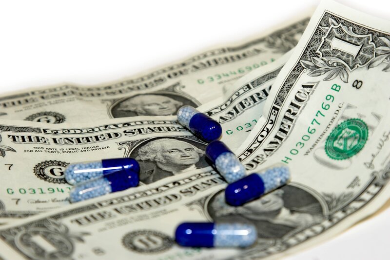 Blue Capsules on Money