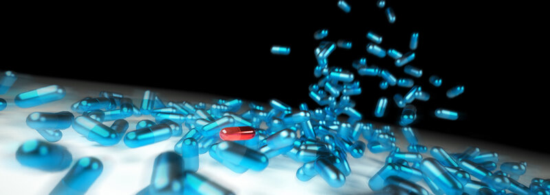 Blue capsules with red pill