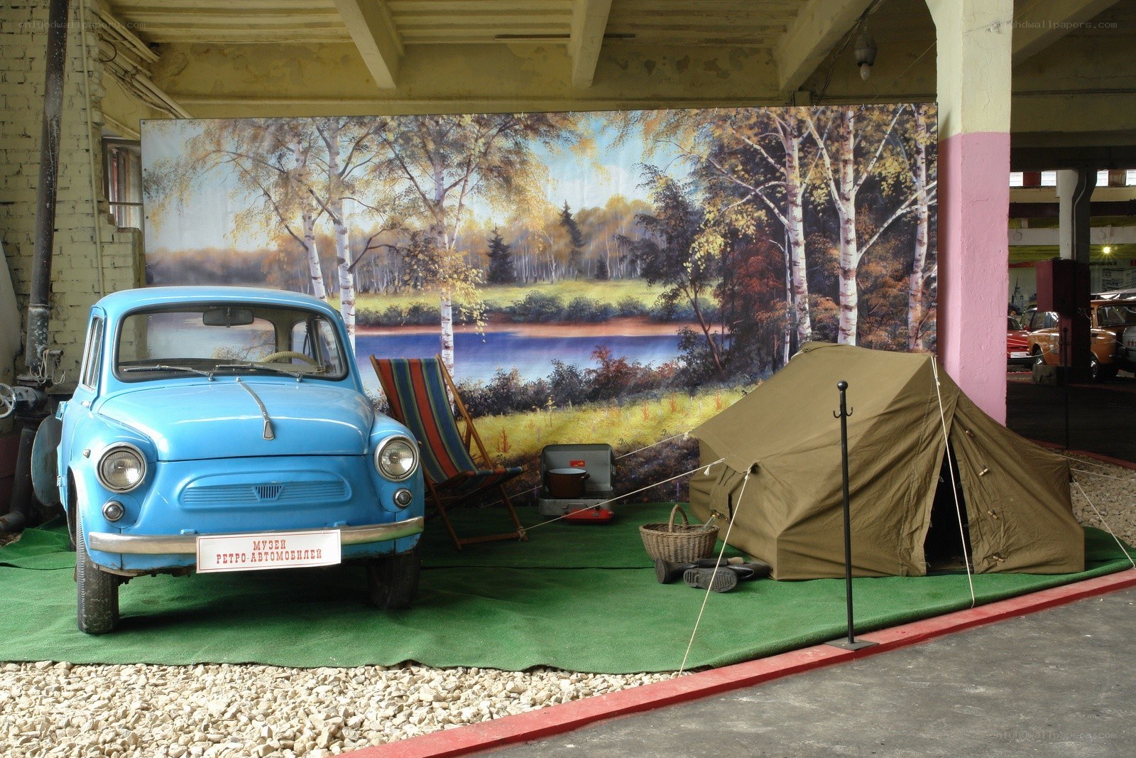 Blue car and camping display