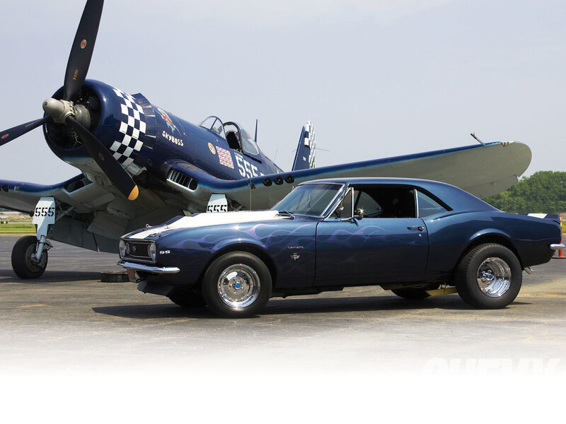 Blue car and vintage plane