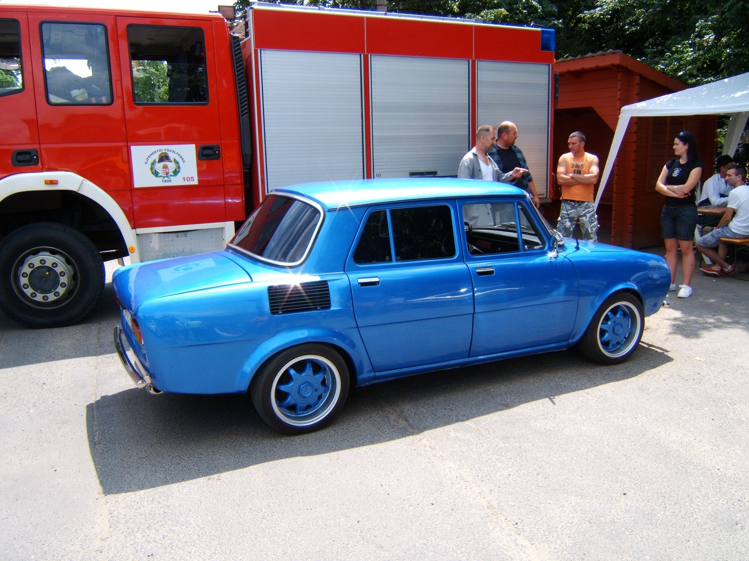 Blue car at a car show