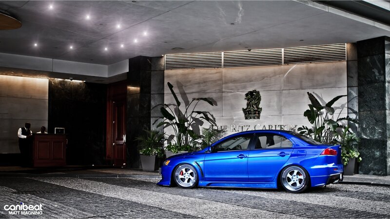 Blue car at hotel entrance