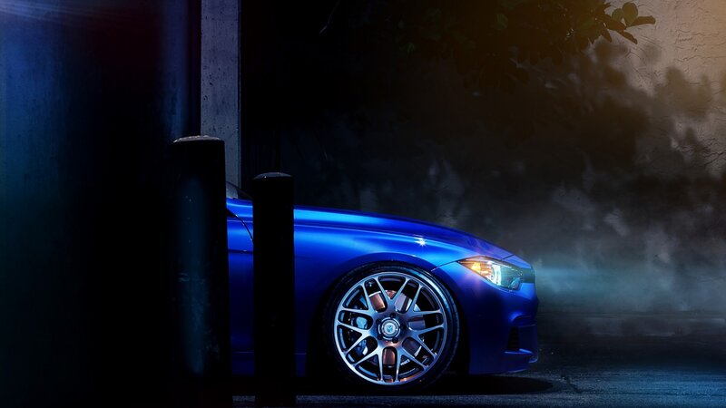 blue car at night with headlights