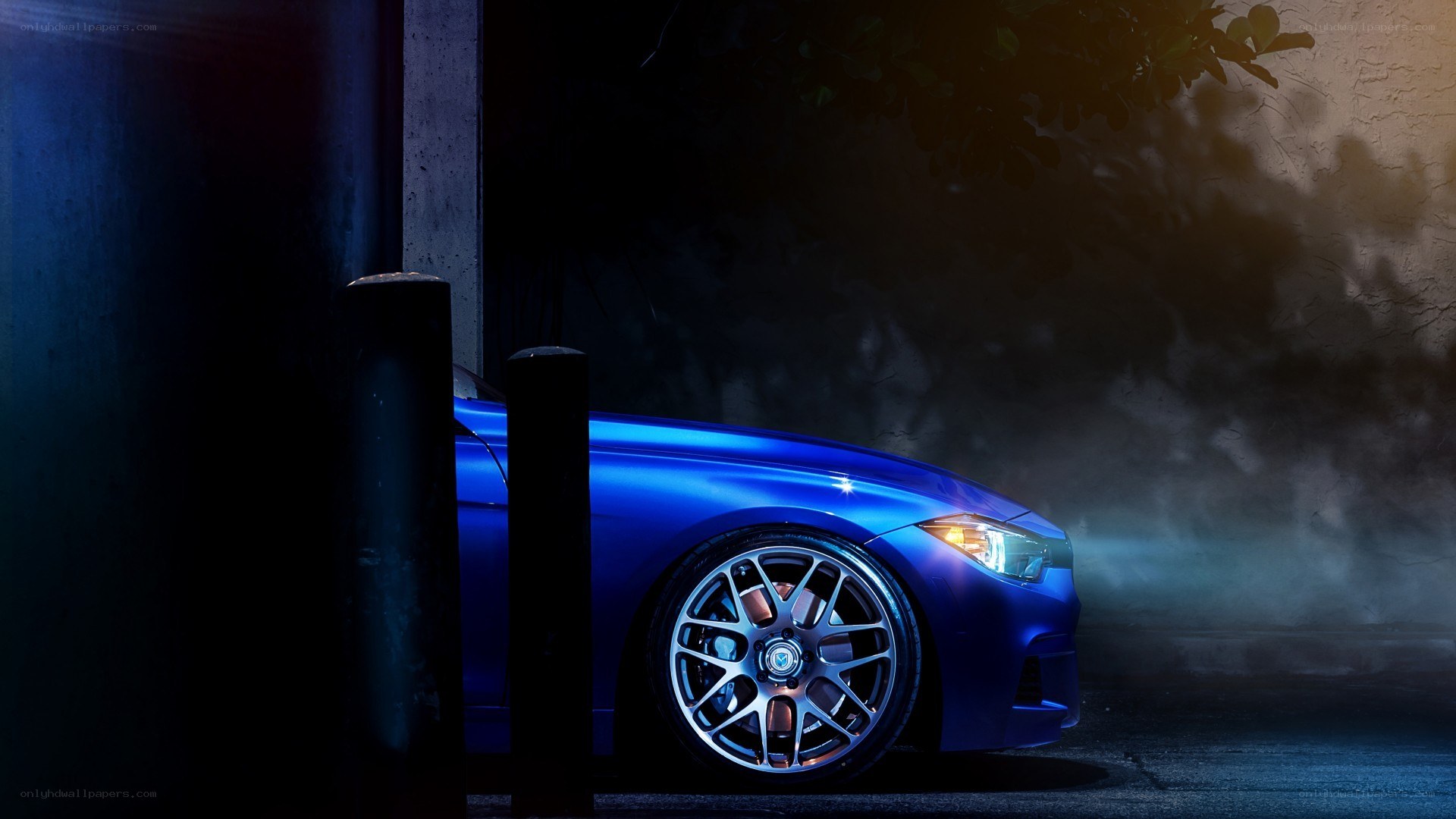 blue car at night with headlights