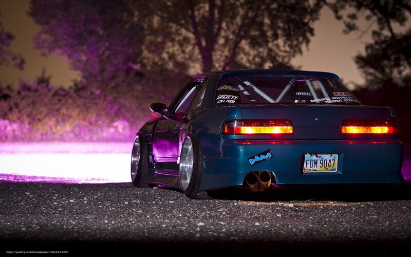 blue car at night with purple lights
