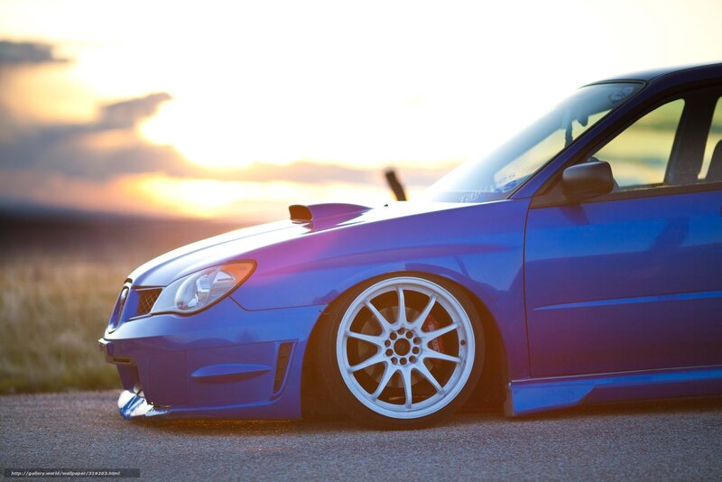 blue car at sunset