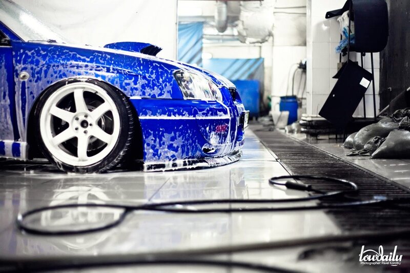 Blue car being washed