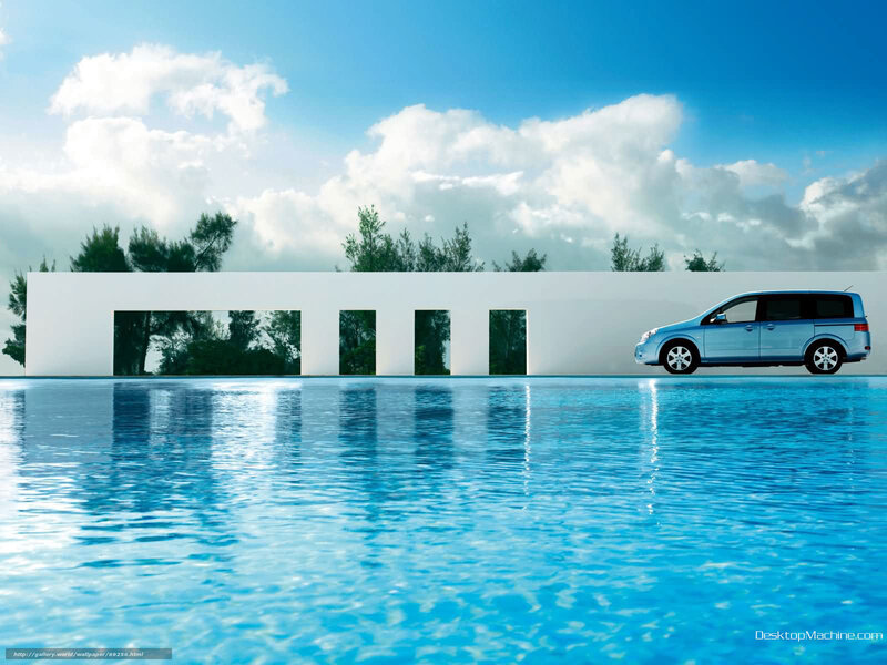 Blue car by poolside