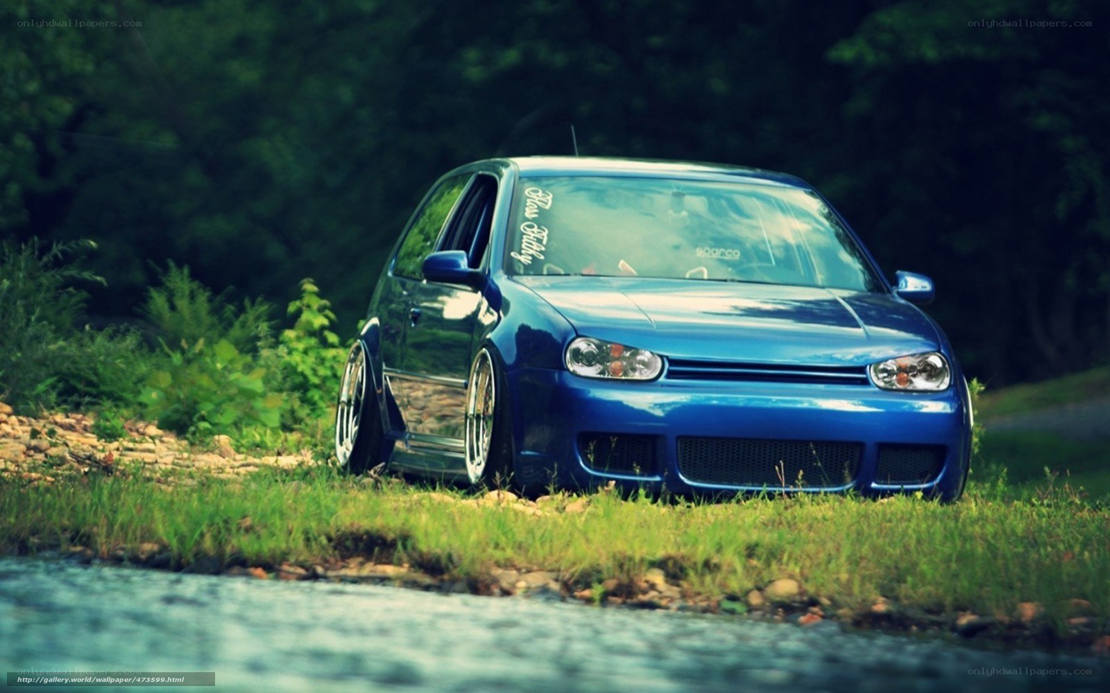 blue car by the river