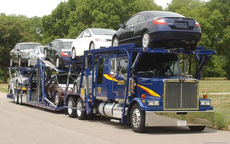 Blue car carrier truck loaded with vehicles