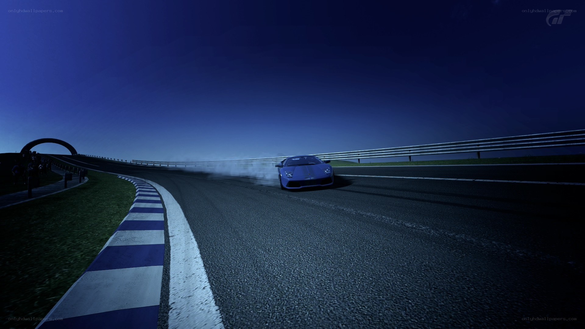 Blue car drifting at night